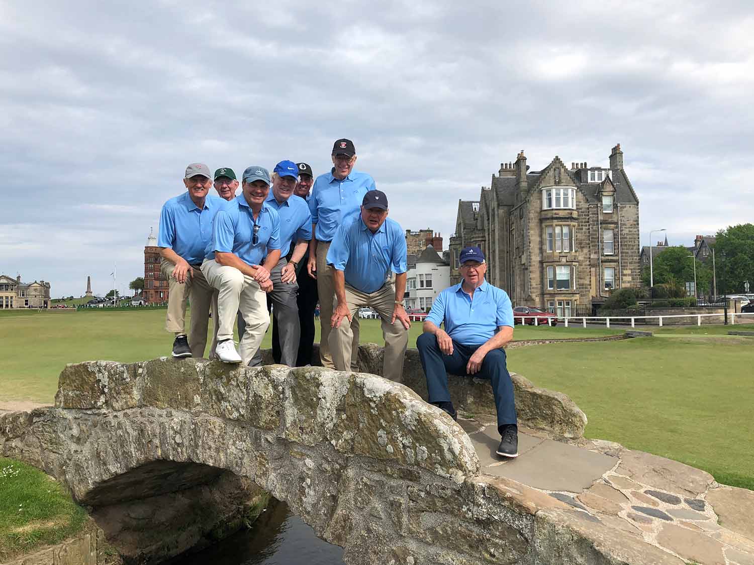 Golfers taking photo on Swilcan Bridge